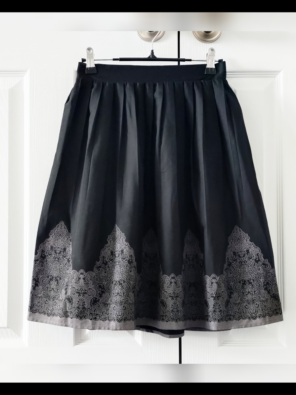 Axes Femme - Pleated Black Skirt with Gray Filigree Design